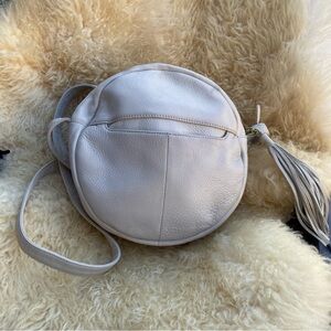HOBO groove round leather crossbody bag purse white tassel